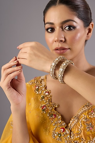 Antique Gold Finish Kundan Polki & Pearl Bangles (Set Of 2) by Preeti Mohan