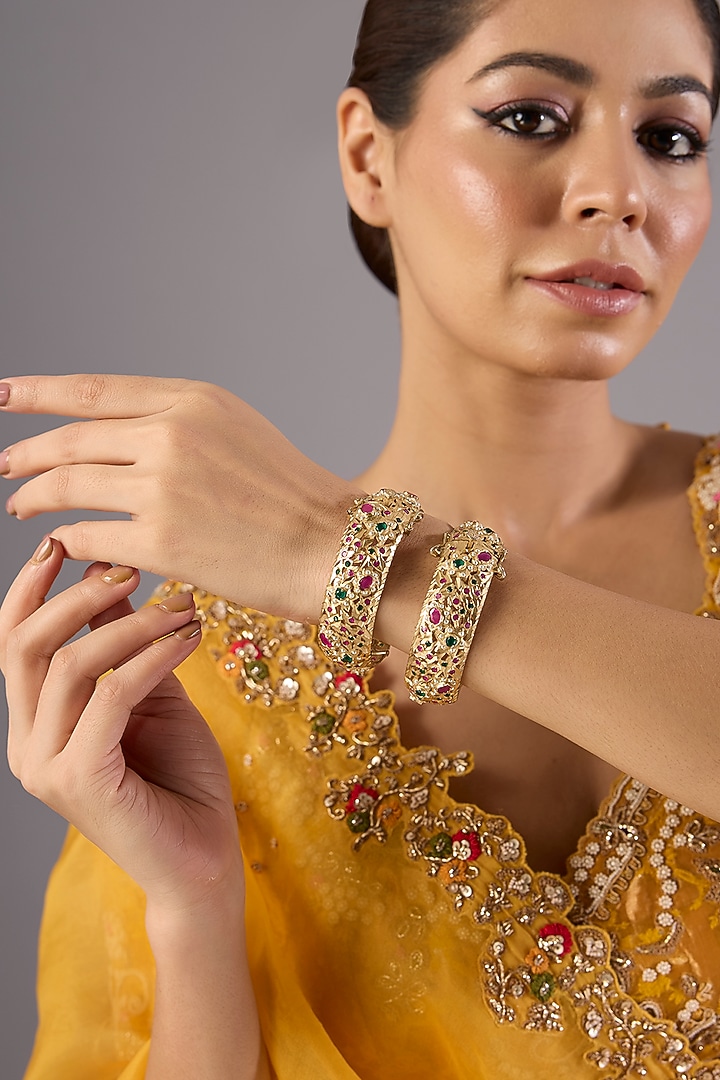 Antique Gold Finish Kundan Polki & Pearl Bangles (Set Of 2) by Preeti Mohan at Pernia's Pop Up Shop