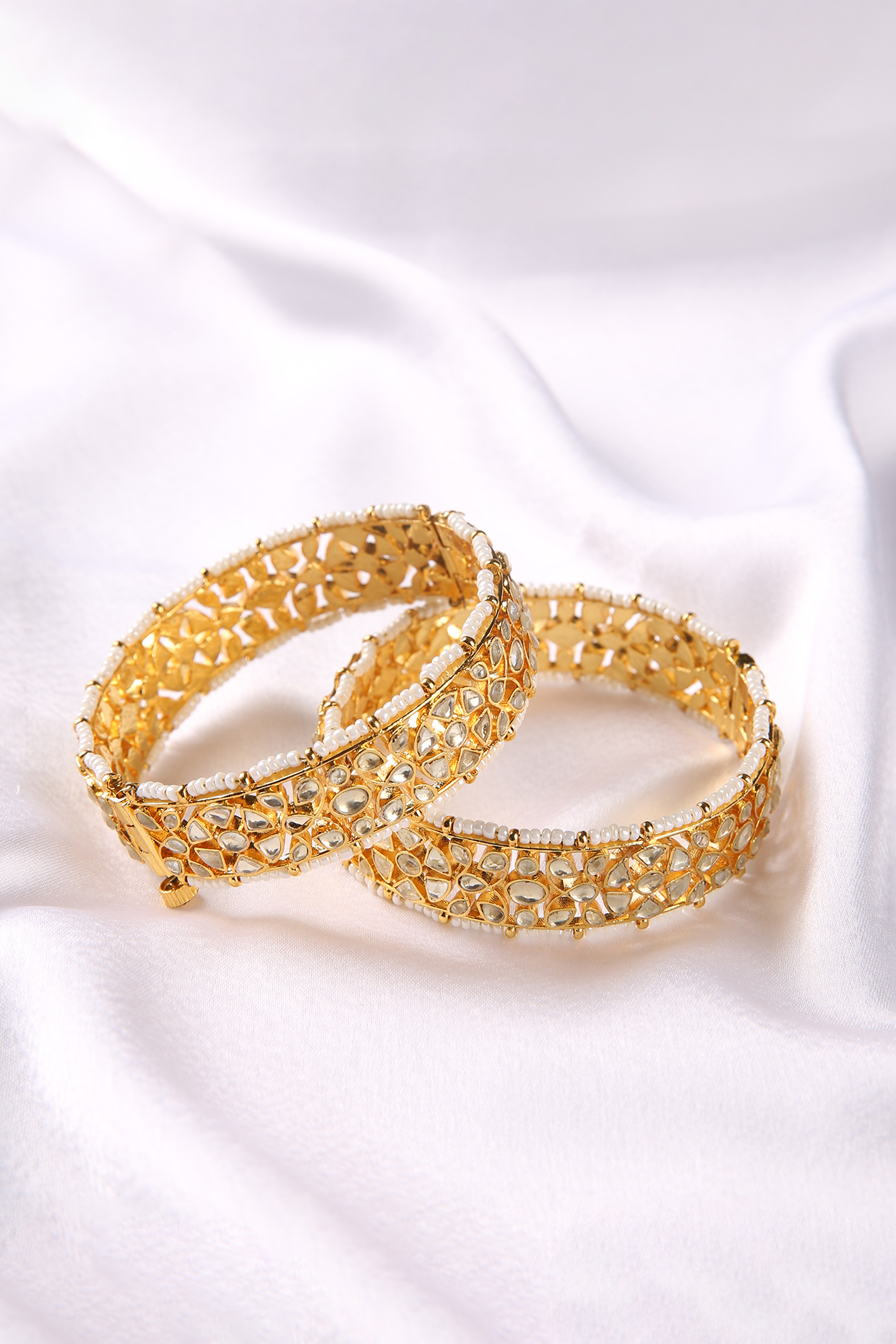 Gold Plated White Stone Bangles (Set Of 2) by Preeti Mohan at Pernia's Pop Up Shop