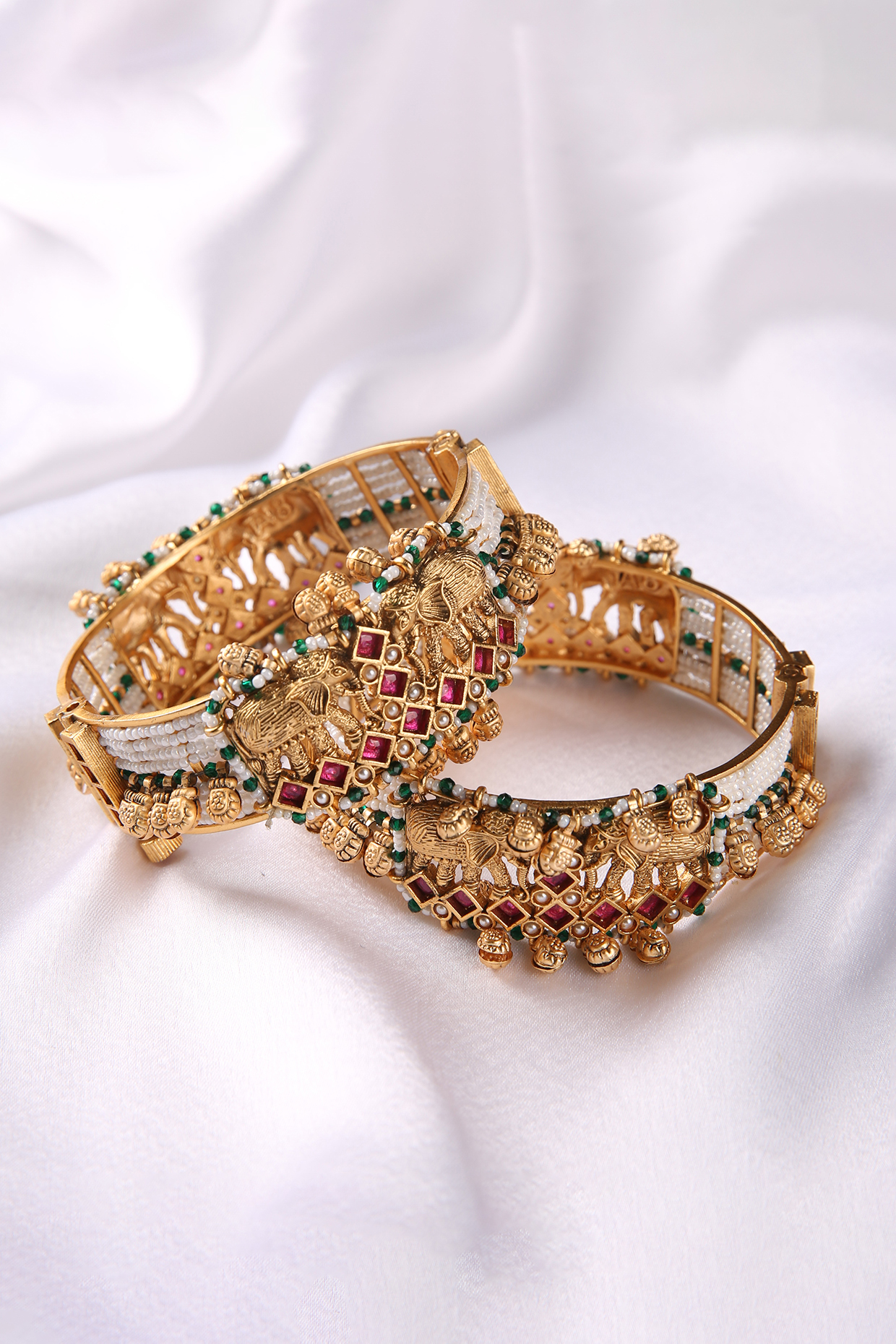 Gold Plated Red & Green Stone Bangles (Set Of 2) by Preeti Mohan at Pernia's Pop Up Shop