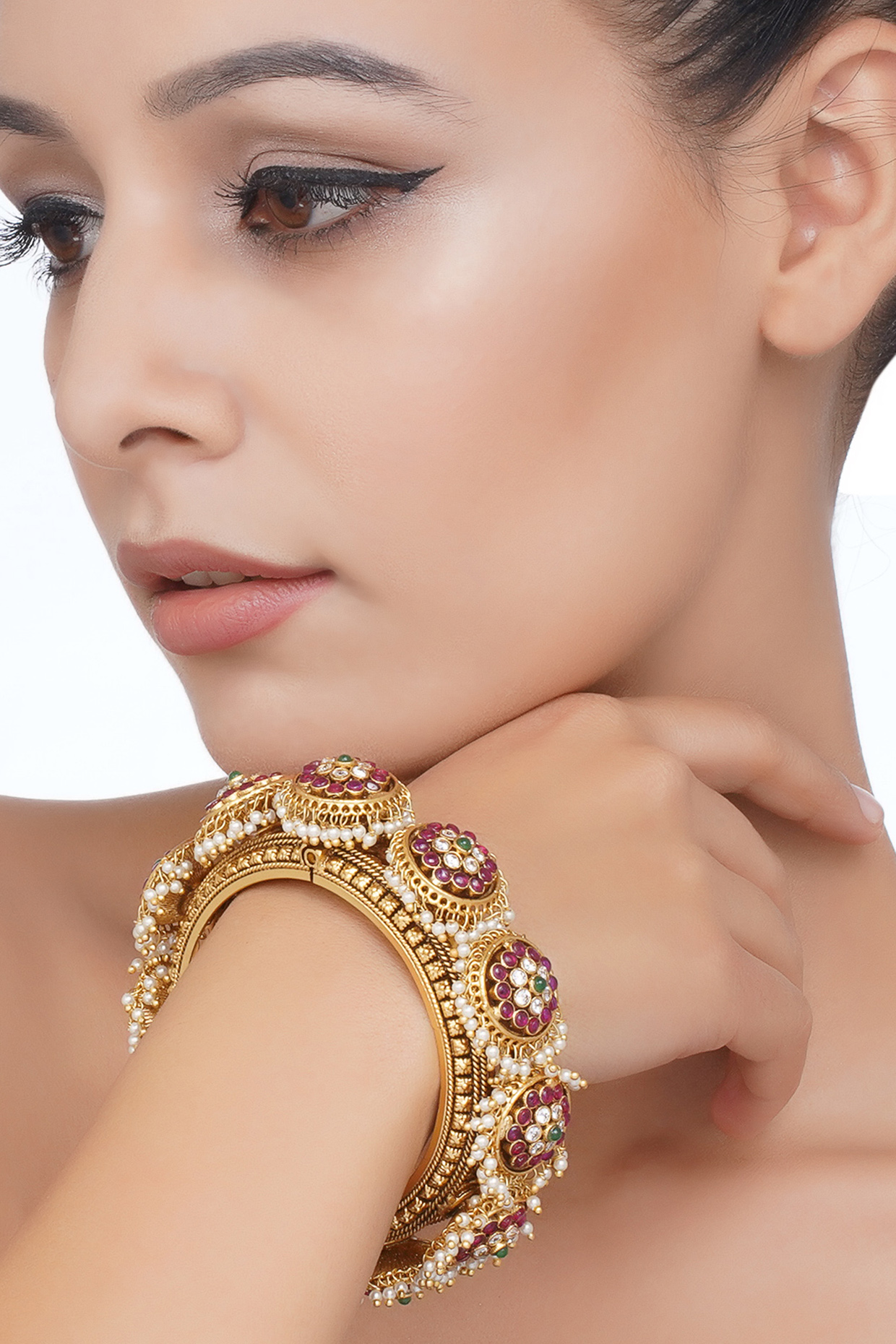 Gold Plated Red & Green Stone Bangles (Set Of 2) by Preeti Mohan at Pernia's Pop Up Shop