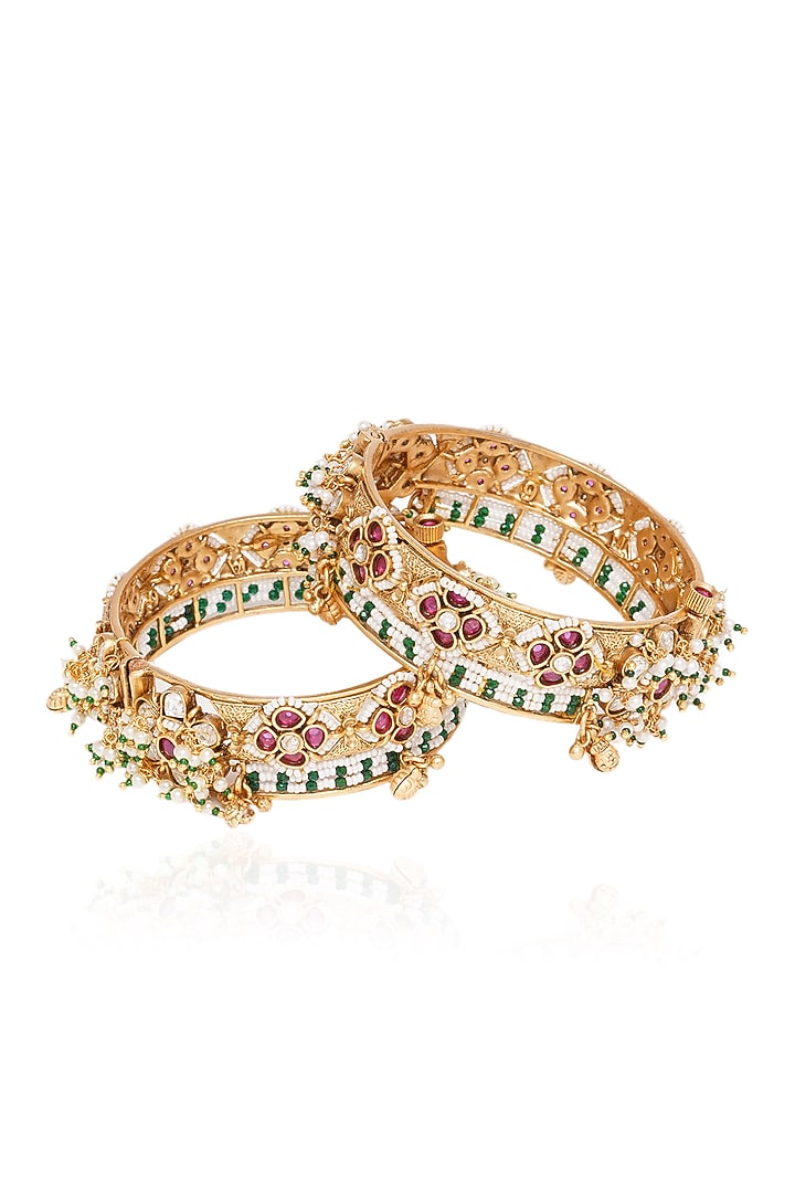 Gold Plated Red & Green Stone Bangles (Set Of 2) by Preeti Mohan at Pernia's Pop Up Shop