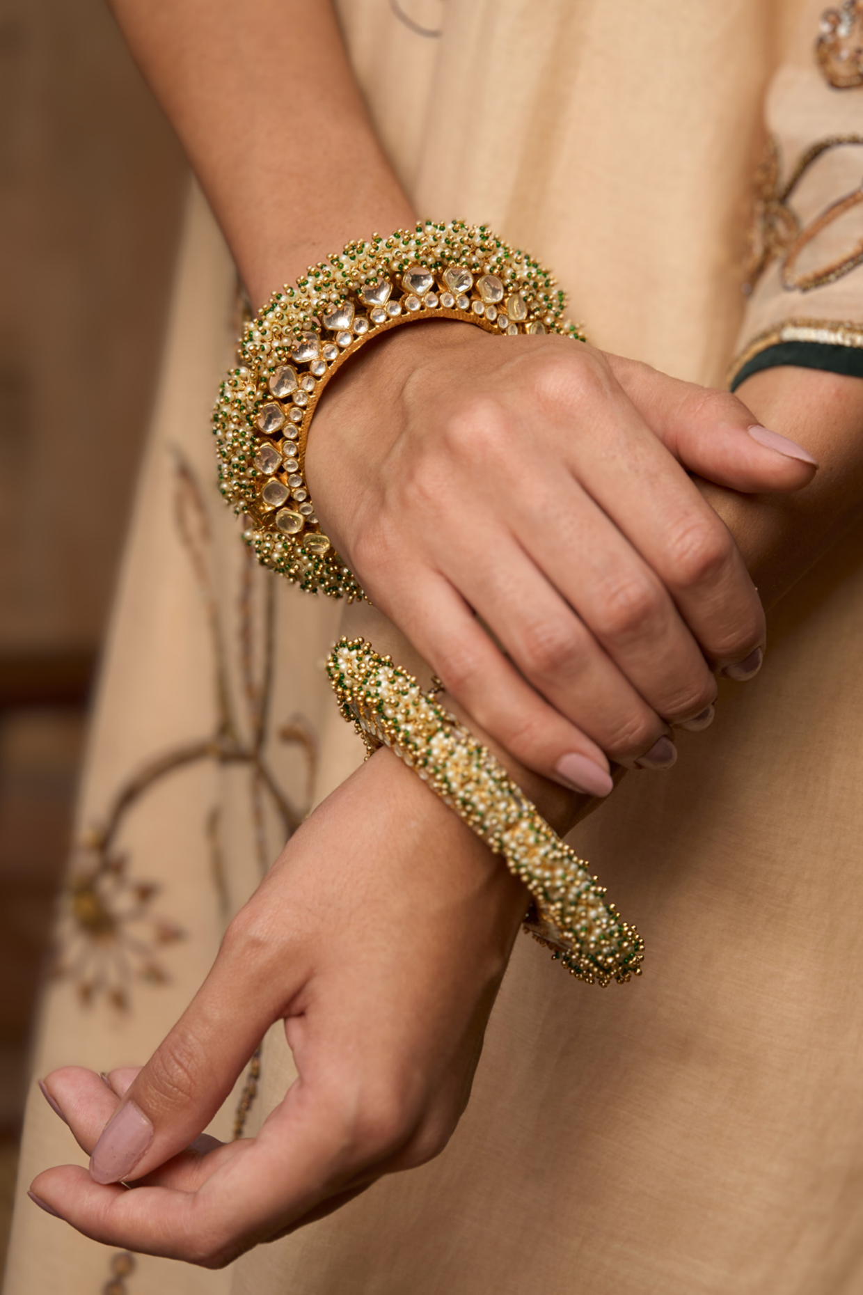 Gold Plated White & Green Stone Bangles (Set Of 2) by Preeti Mohan at Pernia's Pop Up Shop