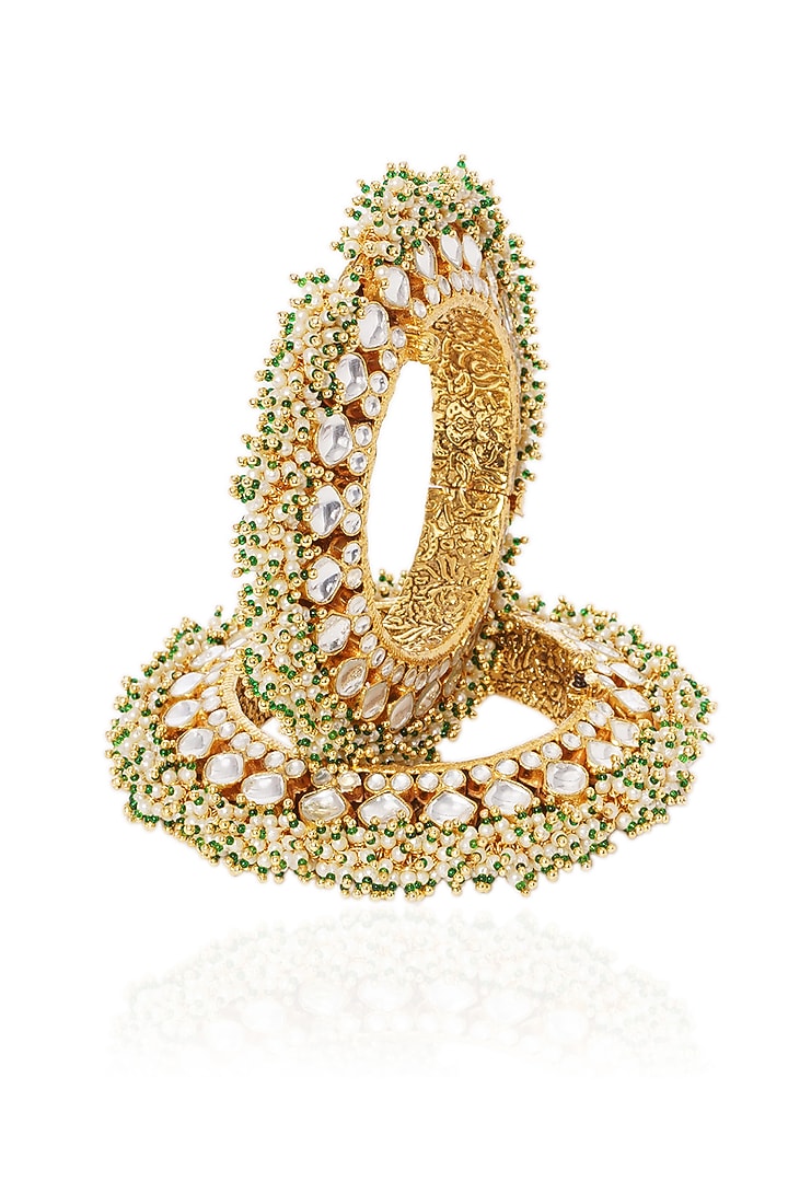 Gold Plated White & Green Stone Bangles (Set Of 2) by Preeti Mohan at Pernia's Pop Up Shop
