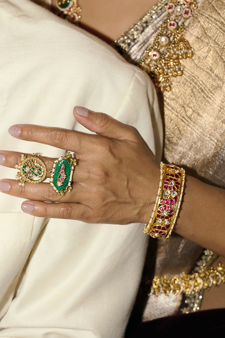 Gold Finish Red & Green Kundan Polki Bangles (Set Of 2) by Preeti Mohan at Pernia's Pop Up Shop
