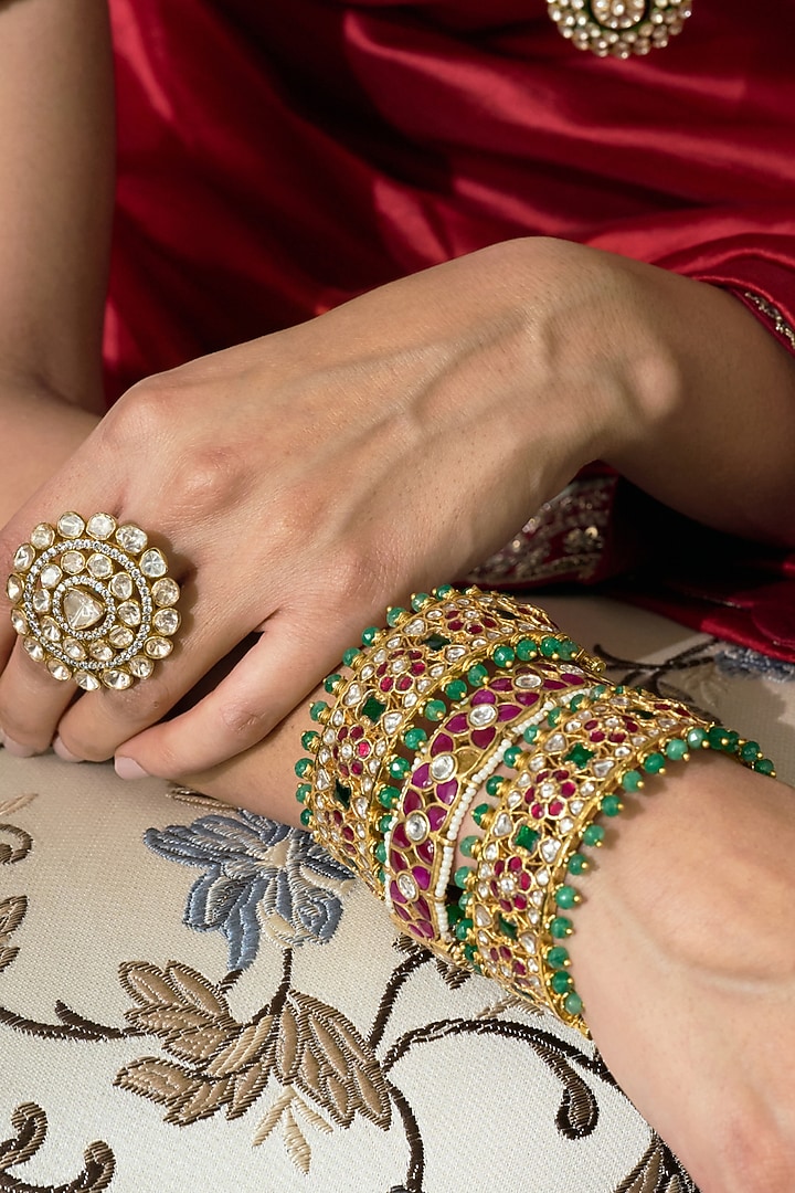 Gold Finish Red & Green Kundan Polki Bangles (Set Of 2) by Preeti Mohan at Pernia's Pop Up Shop