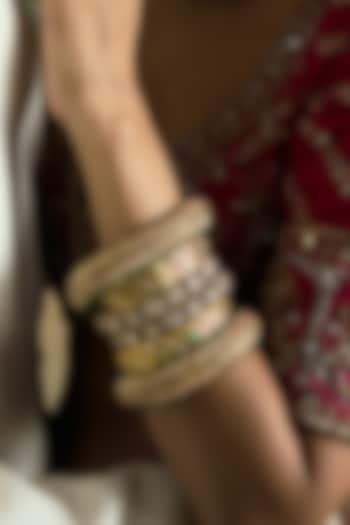 Gold Finish Red Kundan Polki Bangles (Set Of 2) by Preeti Mohan at Pernia's Pop Up Shop