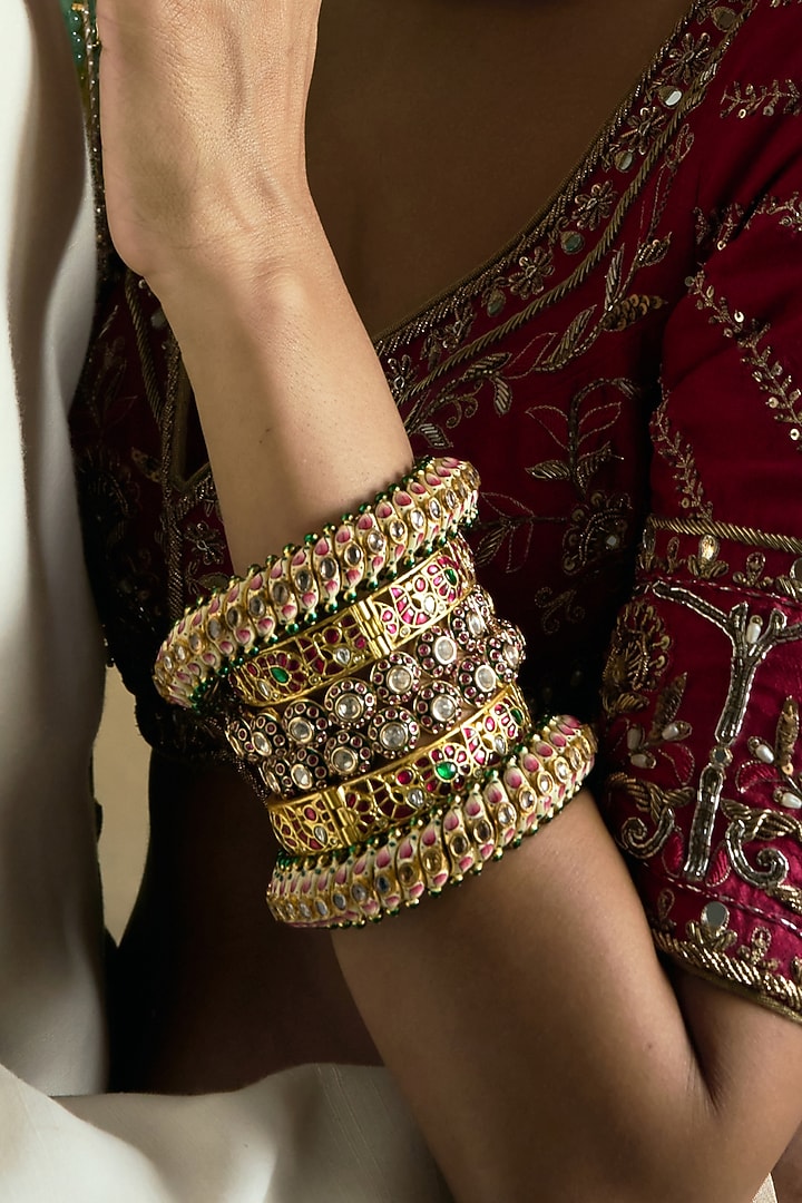 Gold Finish Red Kundan Polki Bangles (Set Of 2) by Preeti Mohan at Pernia's Pop Up Shop