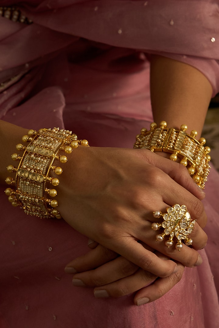 Gold Finish Kundan Polki Bangles (Set Of 2) by Preeti Mohan at Pernia's Pop Up Shop