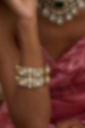 Antique Gold Finish Kundan Polki Bangles (Set Of 2) by Preeti Mohan at Pernia's Pop Up Shop