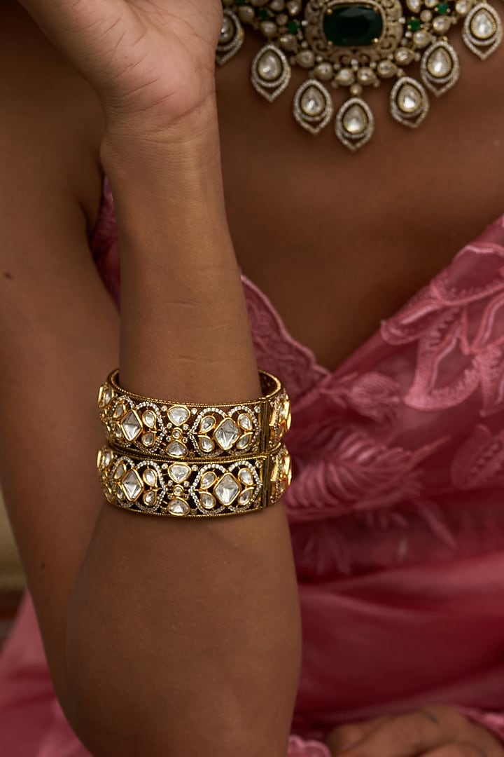 Antique Gold Finish Kundan Polki Bangles (Set Of 2) by Preeti Mohan at Pernia's Pop Up Shop