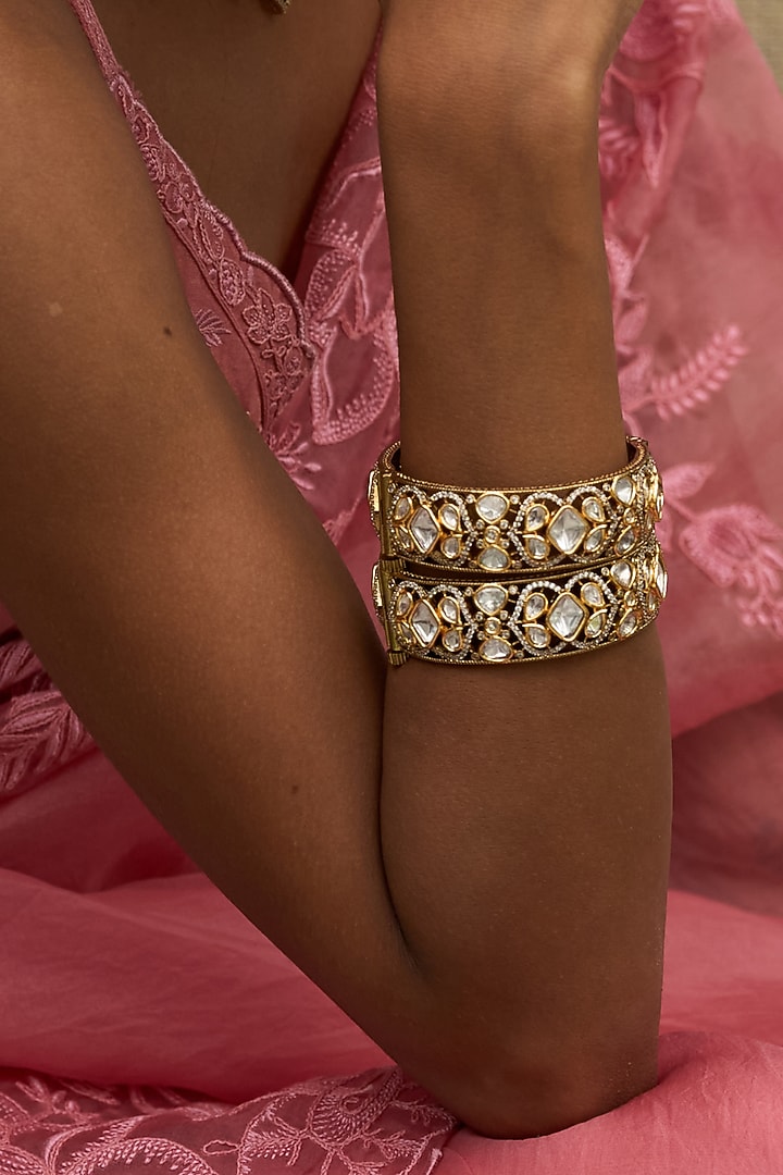 Antique Gold Finish Kundan Polki Bangles (Set Of 2) by Preeti Mohan at Pernia's Pop Up Shop