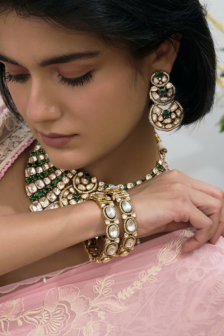 Antique Gold Finish Kundan Polki Bangles (Set Of 2) by Preeti Mohan at Pernia's Pop Up Shop