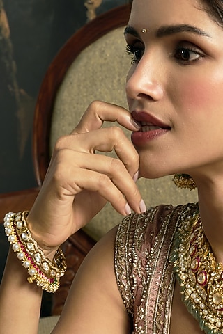 Antique Gold Finish Kundan Polki Bangles (Set Of 2) by Preeti Mohan