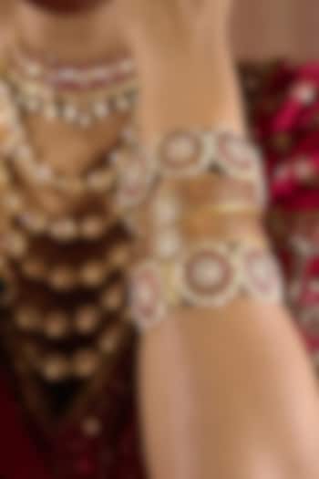 Gold Finish Red Kundan Polki Bangles (Set Of 2) by Preeti Mohan at Pernia's Pop Up Shop