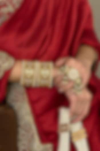 Gold Finish Red Kundan Polki Bangles (Set Of 2) by Preeti Mohan at Pernia's Pop Up Shop