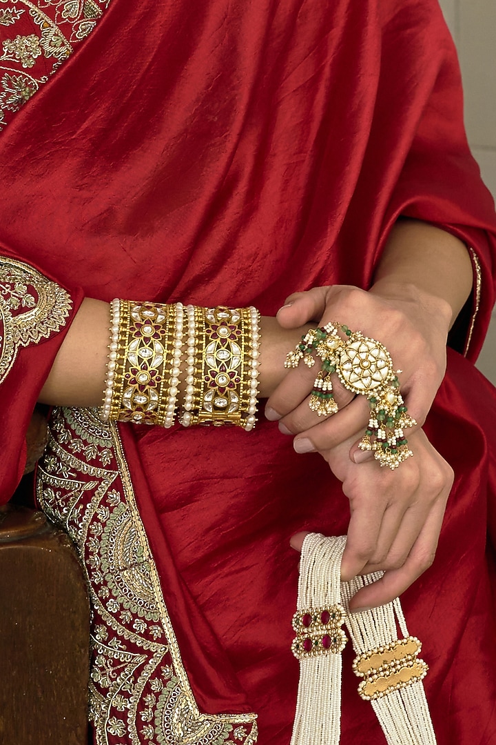 Gold Finish Red Kundan Polki Bangles (Set Of 2) by Preeti Mohan at Pernia's Pop Up Shop