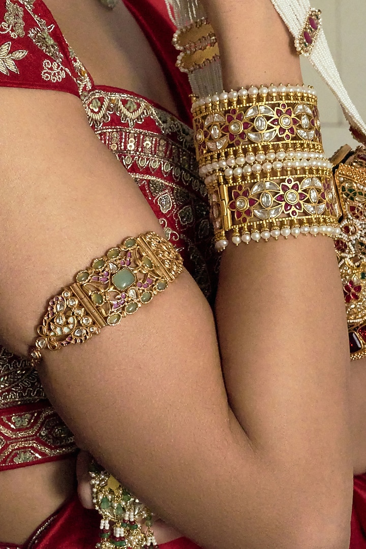 Gold Finish Red Kundan Polki Bangles (Set Of 2) by Preeti Mohan at Pernia's Pop Up Shop