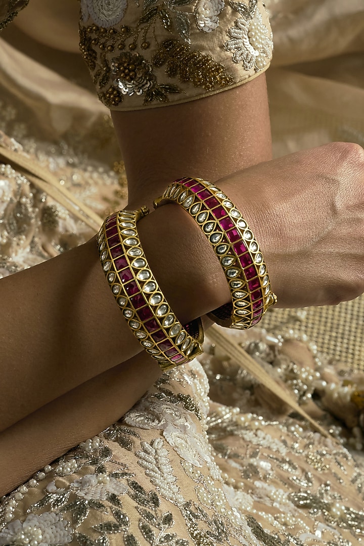 Gold Finish Red Kundan Polki Bangles (Set Of 2) by Preeti Mohan at Pernia's Pop Up Shop