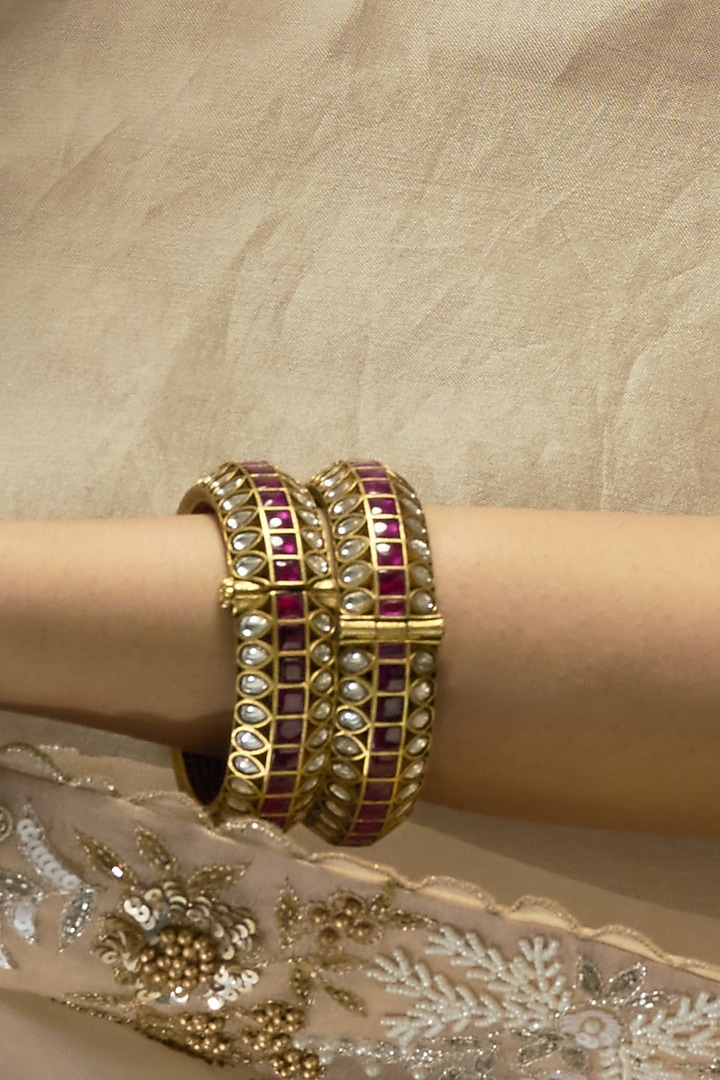 Gold Finish Red Kundan Polki Bangles (Set Of 2) by Preeti Mohan at Pernia's Pop Up Shop