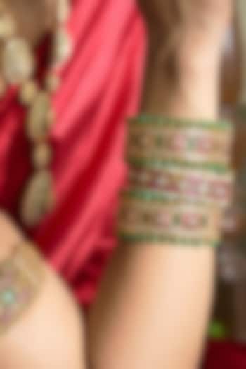 Gold Finish Red Kundan Polki Bangles (Set Of 2) by Preeti Mohan at Pernia's Pop Up Shop