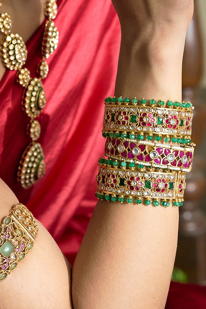 Gold Finish Red Kundan Polki Bangles (Set Of 2) by Preeti Mohan at Pernia's Pop Up Shop