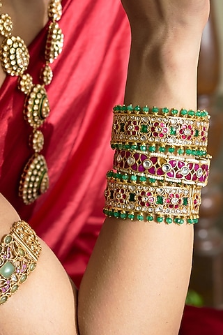 Gold Finish Red Kundan Polki Bangles (Set Of 2) by Preeti Mohan