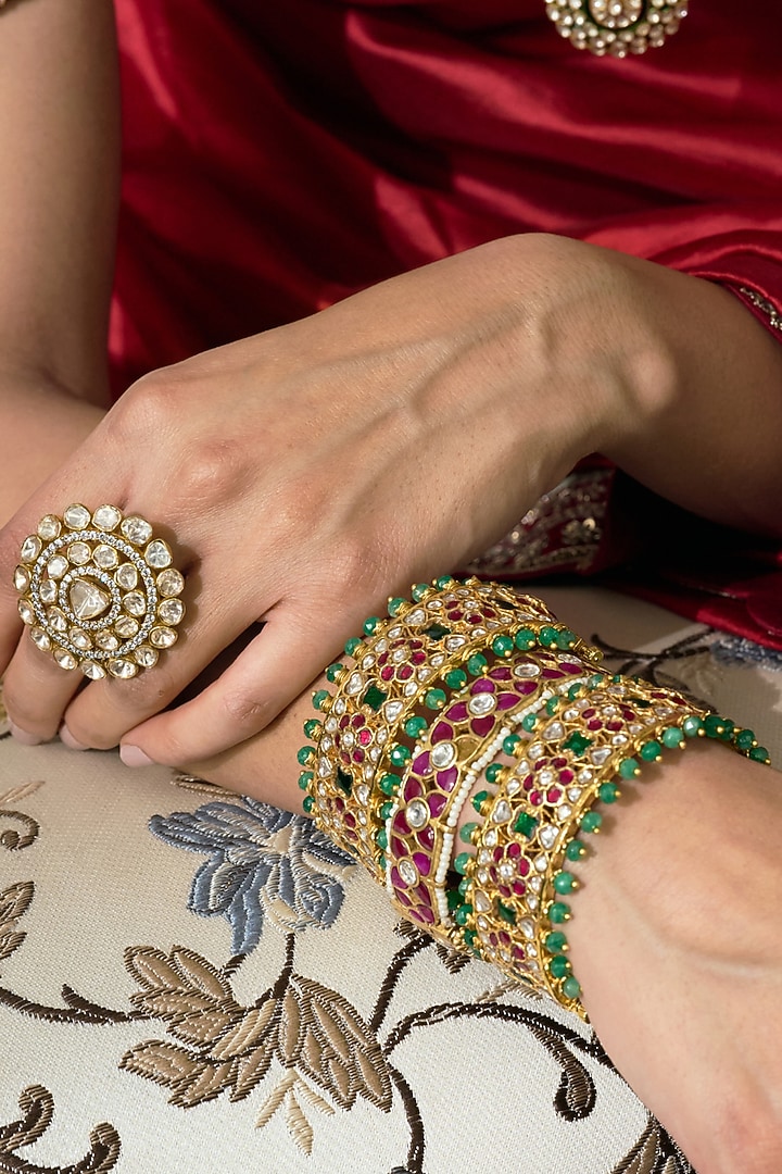 Gold Finish Red Kundan Polki Bangles (Set Of 2) by Preeti Mohan at Pernia's Pop Up Shop