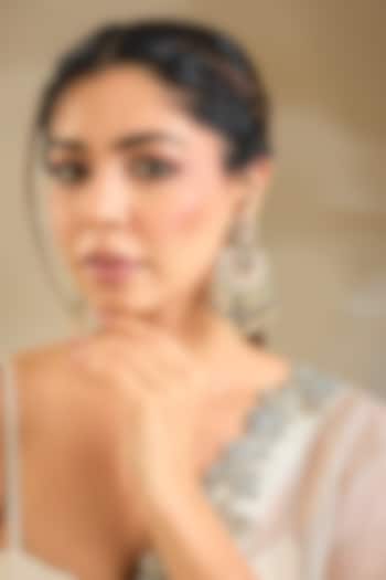 Gold Finish Emerald Stone Dangler Earrings by Preeti Mohan at Pernia's Pop Up Shop