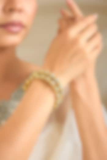 Gold Finish Kundan Polki Bangles (Set Of 2) by Preeti Mohan at Pernia's Pop Up Shop
