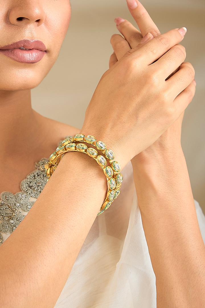Gold Finish Kundan Polki Bangles (Set Of 2) by Preeti Mohan at Pernia's Pop Up Shop