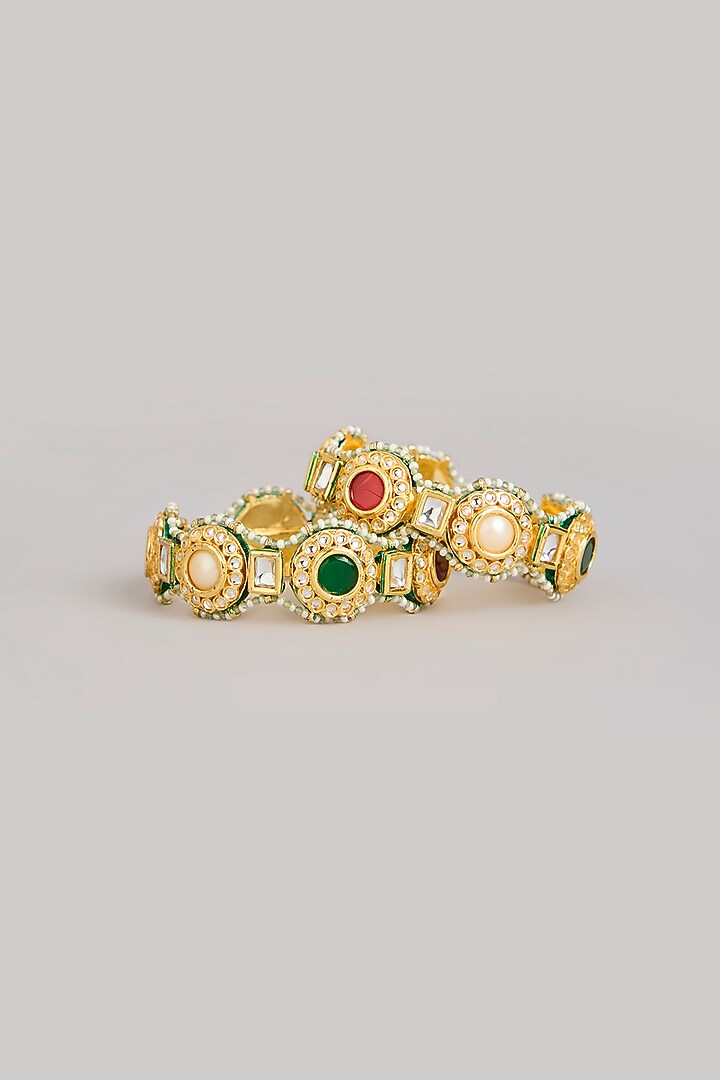 Gold Finish Kundan Polki & Multi-Colored Stone Bangles (Set Of 2) by Preeti Mohan at Pernia's Pop Up Shop