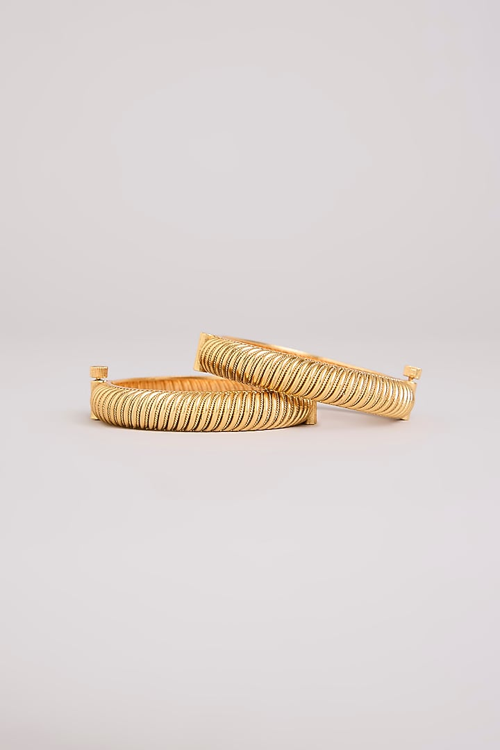 Gold Finish Mixed Metal Bangles (Set Of 2) by Preeti Mohan at Pernia's Pop Up Shop