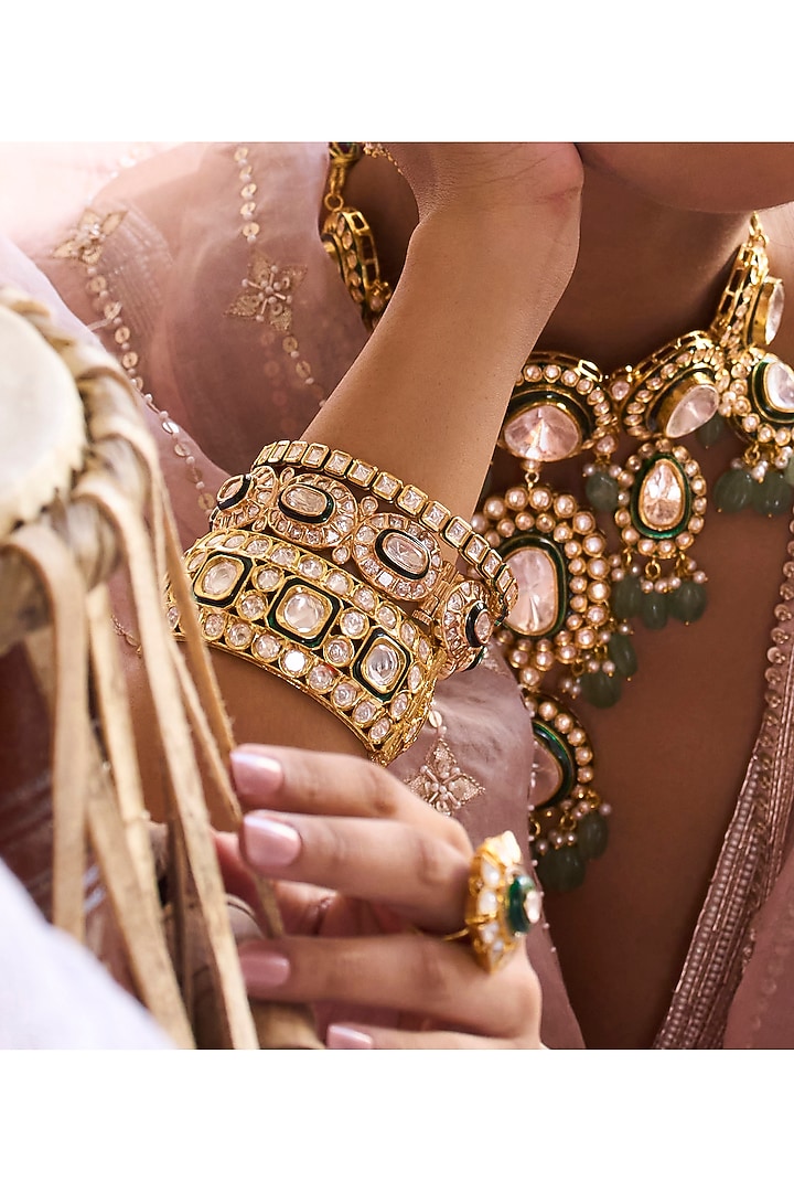Gold Plated Green Stone Bangles (Set Of 2) by Preeti Mohan at Pernia's Pop Up Shop