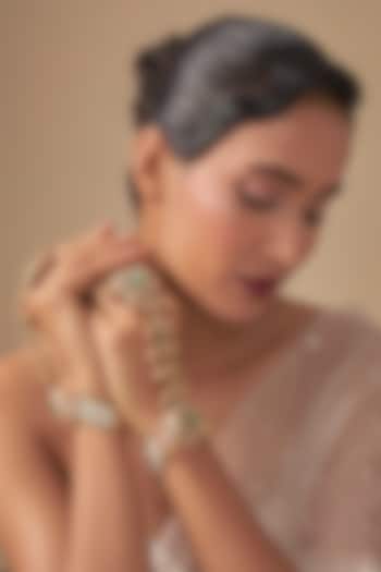 Gold Finish Kundan Polki & Green Stone Haathphools (Sets Of 2) by Preeti Mohan at Pernia's Pop Up Shop