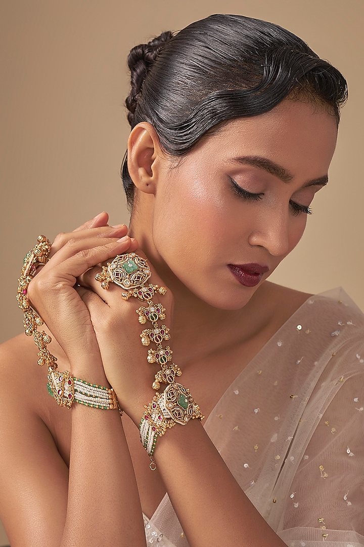 Gold Finish Kundan Polki & Green Stone Haathphools (Sets Of 2) by Preeti Mohan at Pernia's Pop Up Shop