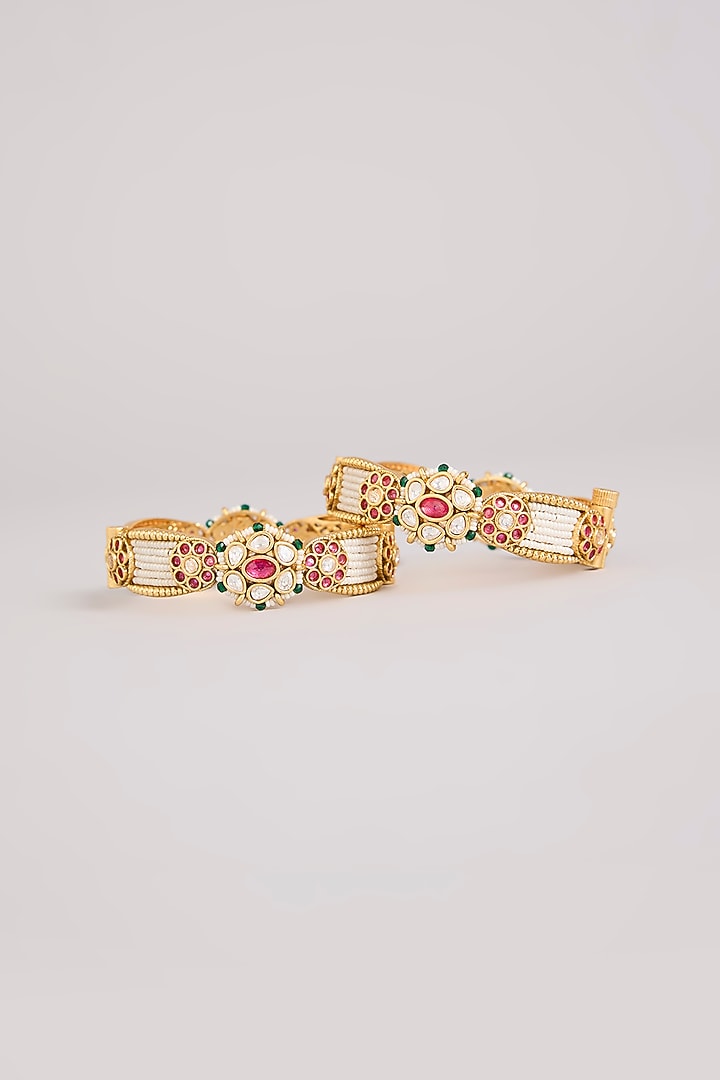 Gold Finish Kundan Polki & Red Stone Bangles (Set Of 2) by Preeti Mohan at Pernia's Pop Up Shop