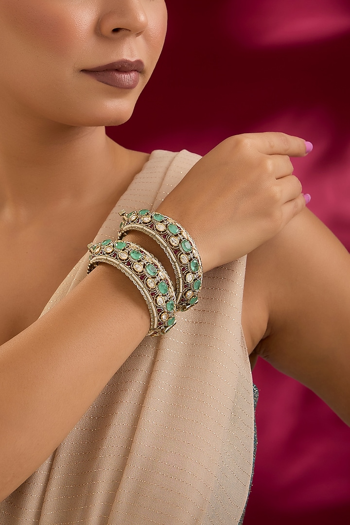 Gold Finish Kundan Polki & Blue Stone Bangles (Set Of 2) by Preeti Mohan at Pernia's Pop Up Shop