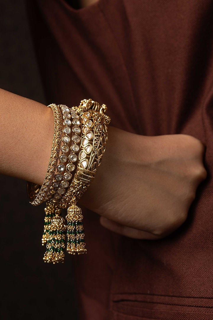 Antique Gold Finish Kundan Polki Bangles (Set Of 2) by Preeti Mohan at Pernia's Pop Up Shop