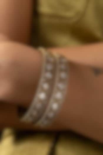 Antique Gold Finish Kundan Polki Bangles (Set Of 2) by Preeti Mohan at Pernia's Pop Up Shop