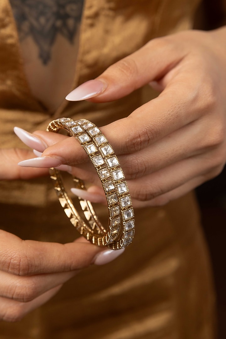 Antique Gold Finish Kundan Polki Bangles (Set Of 2) by Preeti Mohan at Pernia's Pop Up Shop