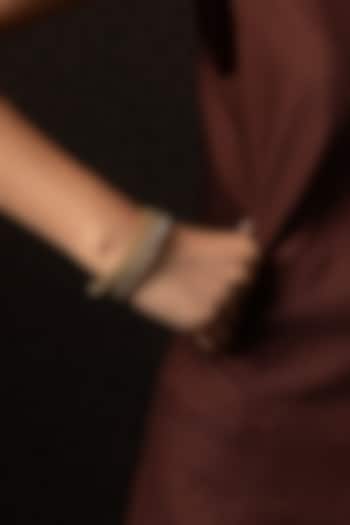 Antique Gold Finish Kundan Polki Bangles (Set Of 2) by Preeti Mohan at Pernia's Pop Up Shop