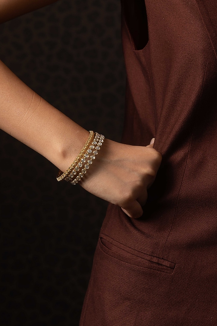Antique Gold Finish Kundan Polki Bangles (Set Of 2) by Preeti Mohan at Pernia's Pop Up Shop