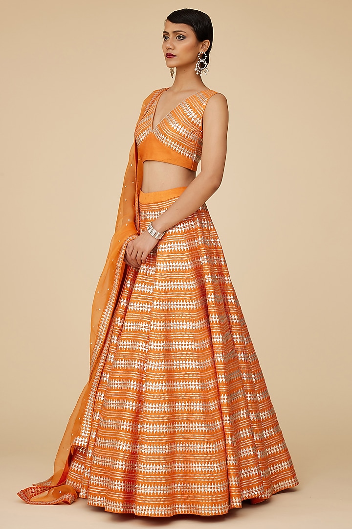 Pumpkin Orange Raw Silk Aari Embroidered Wedding Lehenga Set by Priyal Prakash at Pernia's Pop Up Shop