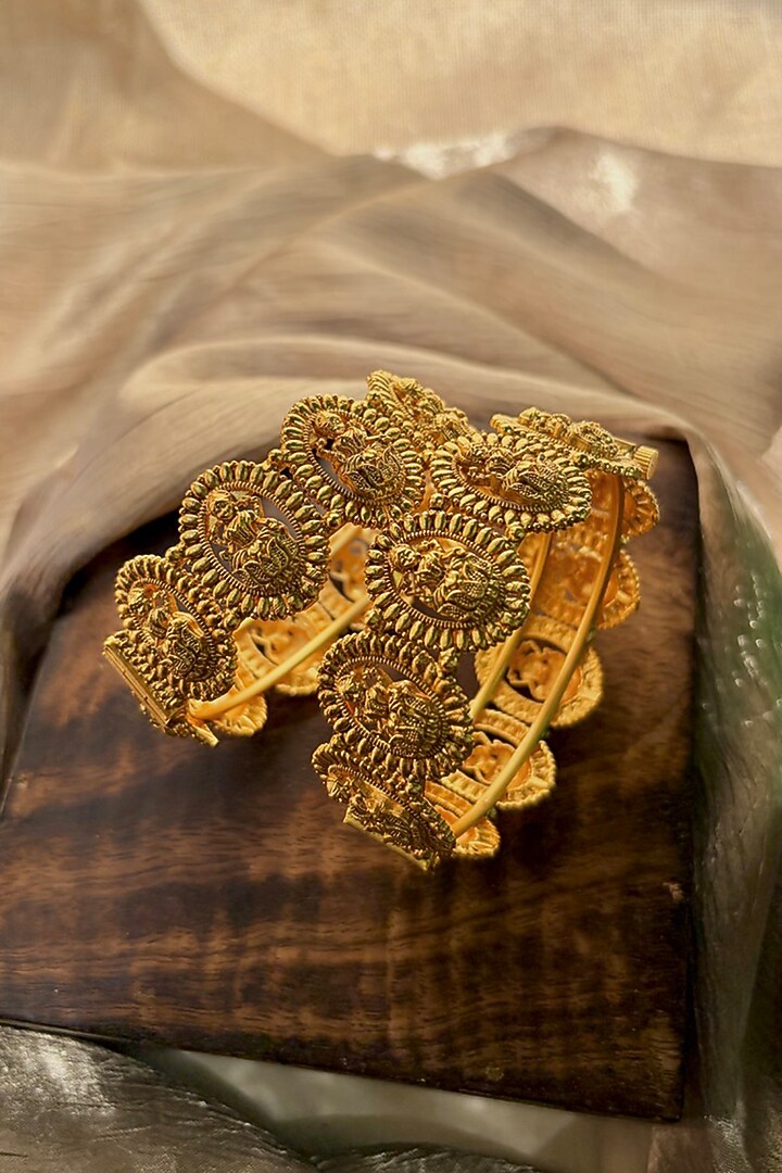 Antique Gold Finish Goddess Lakshmi Motif Temple Bangles (Set Of 2) by Prestones at Pernia's Pop Up Shop