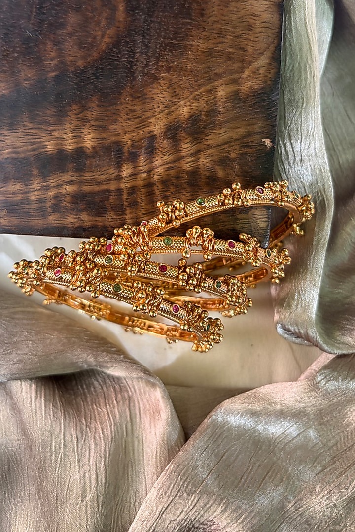Antique Gold Finish Ghungroo Temple Bangles (Set Of 4) by Prestones at Pernia's Pop Up Shop