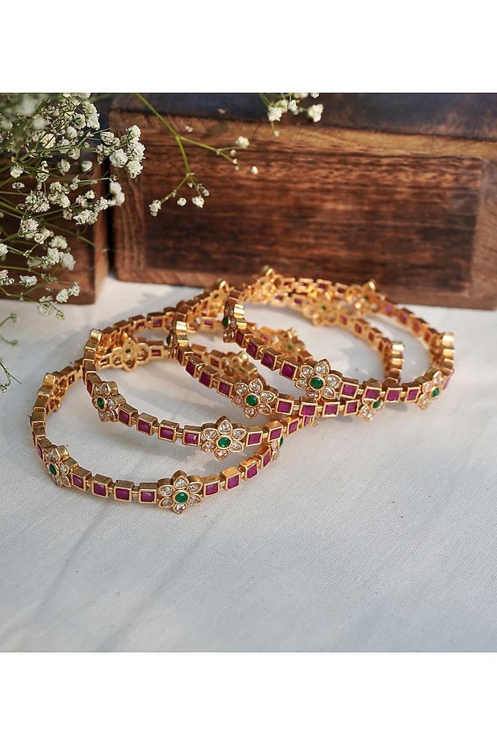 Antique Gold Finish Ruby & Emerald Temple Bangles (Set Of 4) by Prestones at Pernia's Pop Up Shop