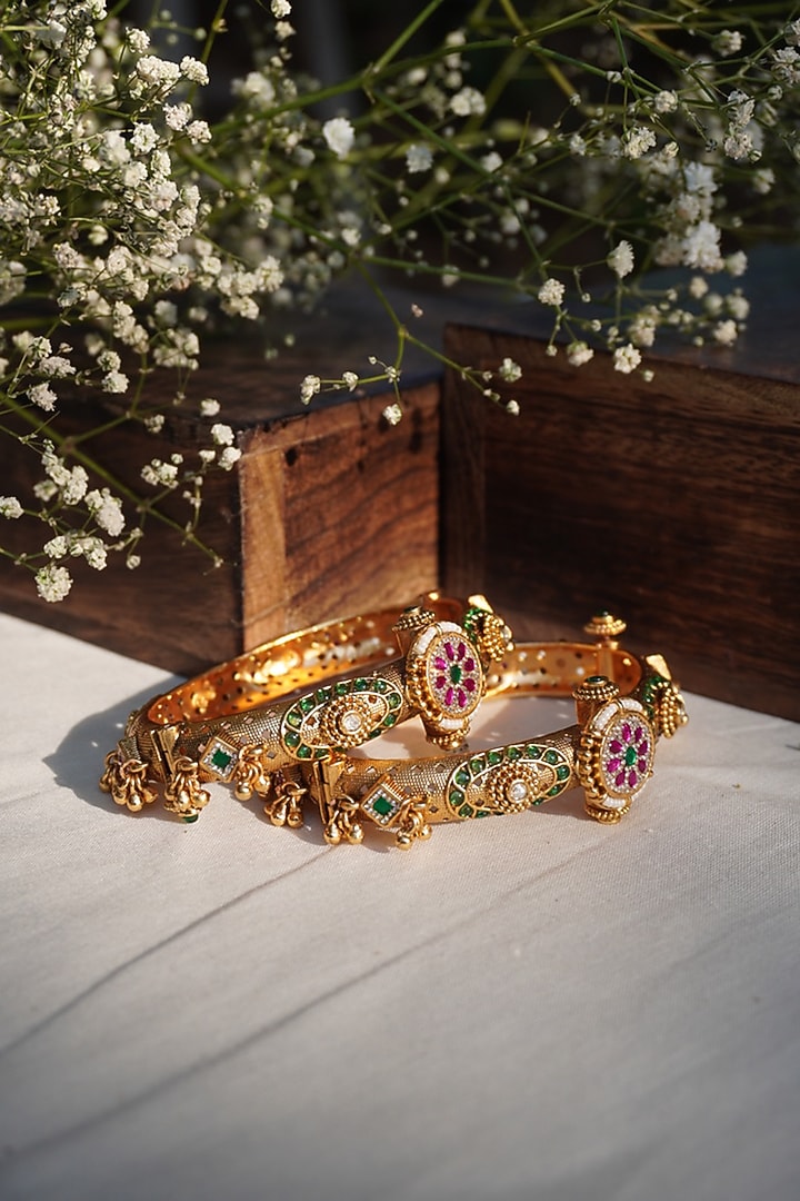 Gold Finish Green & Pink Stone Temple Bangles (Set Of 2) by Prestones at Pernia's Pop Up Shop