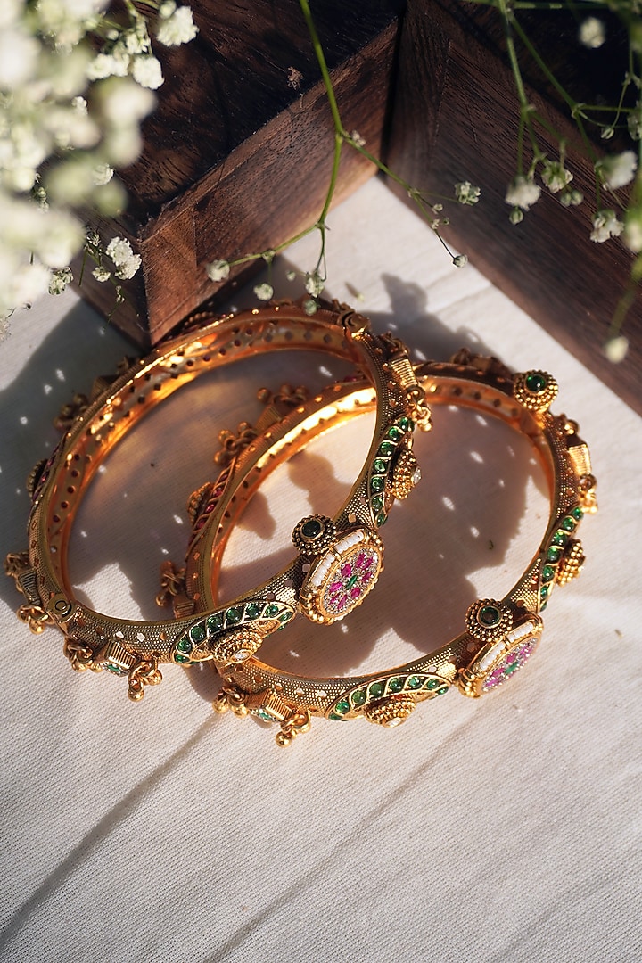 Gold Finish Green & Pink Stone Temple Bangles (Set Of 2) by Prestones at Pernia's Pop Up Shop