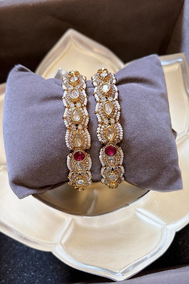 Gold Finish Kundan Polki & Ruby Stone Openable Bangles (Set Of 2) by Prestones at Pernia's Pop Up Shop